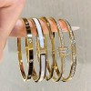 Golden titanium steel bracelet for women, high-end zircon couple bracelet, light luxury plain circle bracelet accessory, light luxury niche